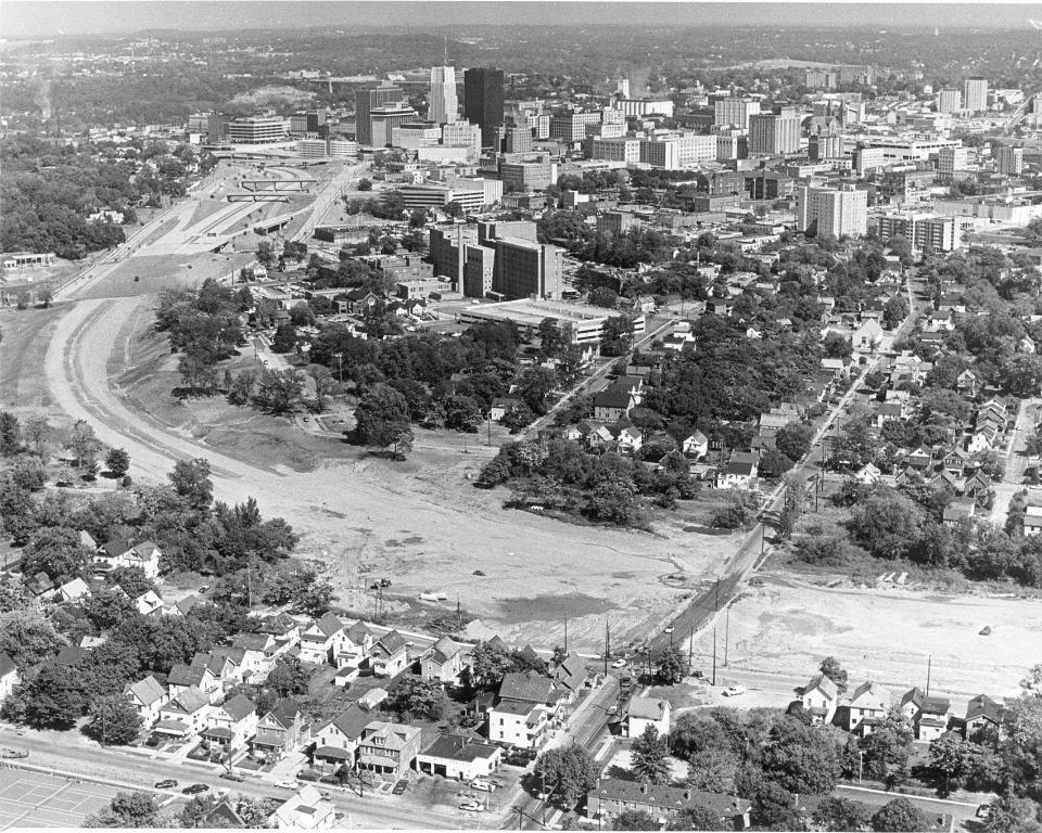 A giant swath of dirt where homes and businesses once stood cut through Akron during early construction of the Innerbelt in the 1970s. The project, billed as urban renewal, decimated Black residential neighborhoods and a Black business district known as "Little Harlem" just north of downtown on and around Howard Street.