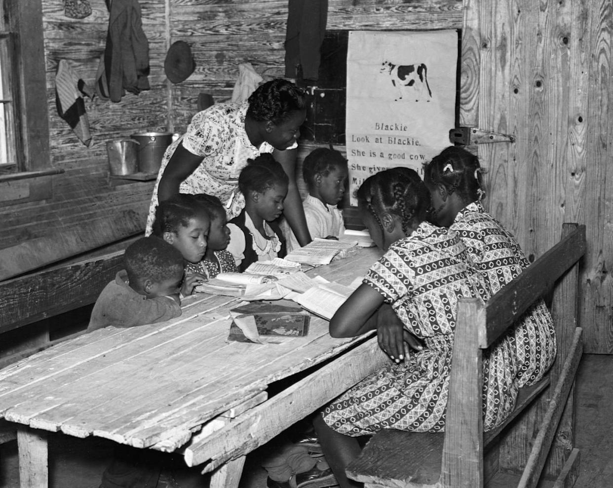 A Black schoolroom in Mississippi in 1939. <a href="https://www.gettyimages.com/detail/news-photo/class-in-a-schoolroom-on-the-mileston-plantation-in-delta-news-photo/615301754?adppopup=true" rel="nofollow noopener" target="_blank" data-ylk="slk:Corbis via Getty Images;elm:context_link;itc:0;sec:content-canvas" class="link ">Corbis via Getty Images</a>