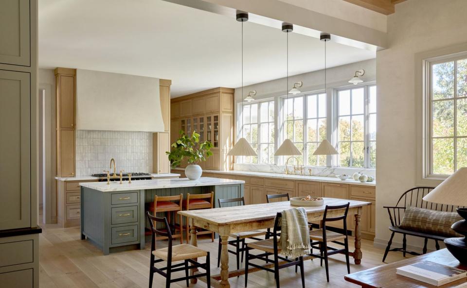 a california kitchen by lauren nelson cabinet paint, caldwell green by benjamin moore pendants, xavier mañosa backsplash, tiles of ezra range, lacanche faucet, waterworks stools, sun at six table, antique via 1stdibs chairs, gio ponti for cassina, design within reach