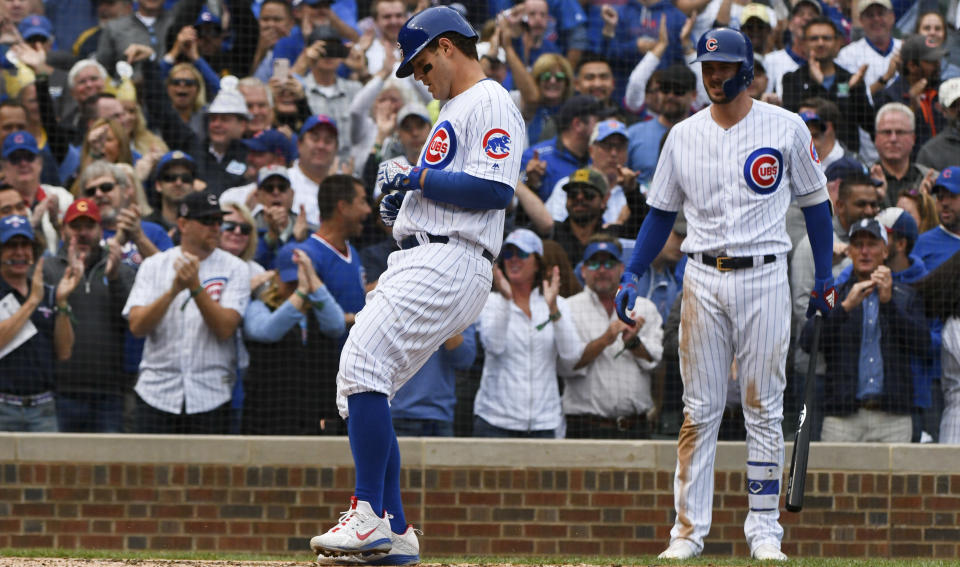 Chicago Cubs' Anthony Rizzo (44) crosses home plate after he hits a home run during the fifth inning of a tie break baseball game against the Milwaukee Brewers on Monday, Oct. 1, 2018, in Chicago. (AP Photo/Matt Marton)