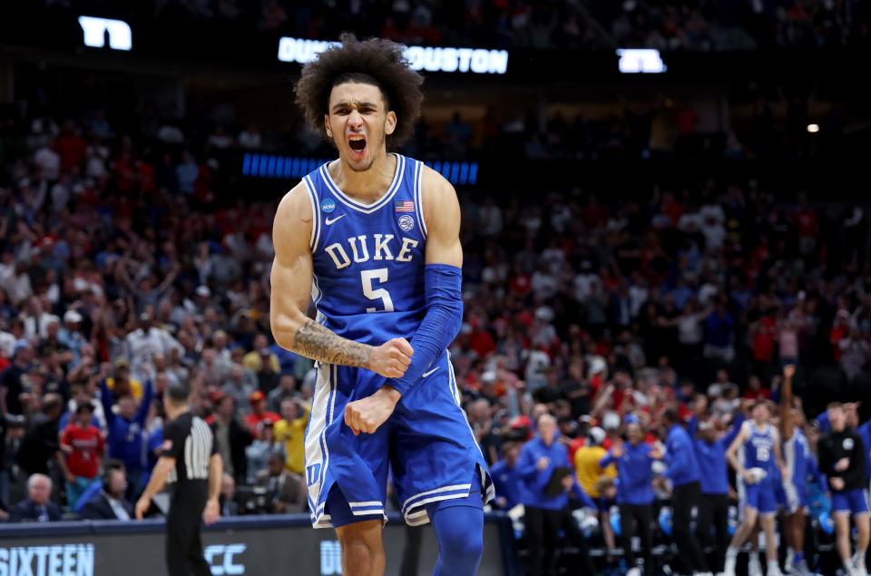 Duke's Tyrese Proctor (5) reacts after defeating the Houston Cougars in the semifinals of the South Regional of the 2024 NCAA Tournament.