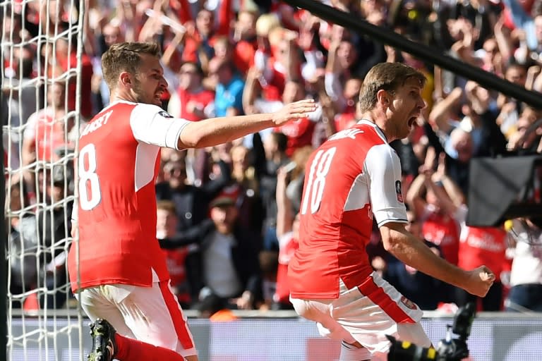 Arsenal's defender Nacho Monreal (R) celebrates scoring their first goal against Manchester City on April 23, 2017