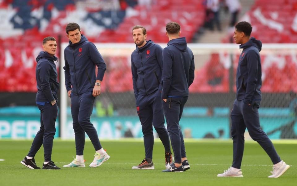England's Harry Kane, Harry Maguire, Kieran Trippier and Marcus Rashford walk on the pitch before the match -  Pool via REUTERS/Carl Recine