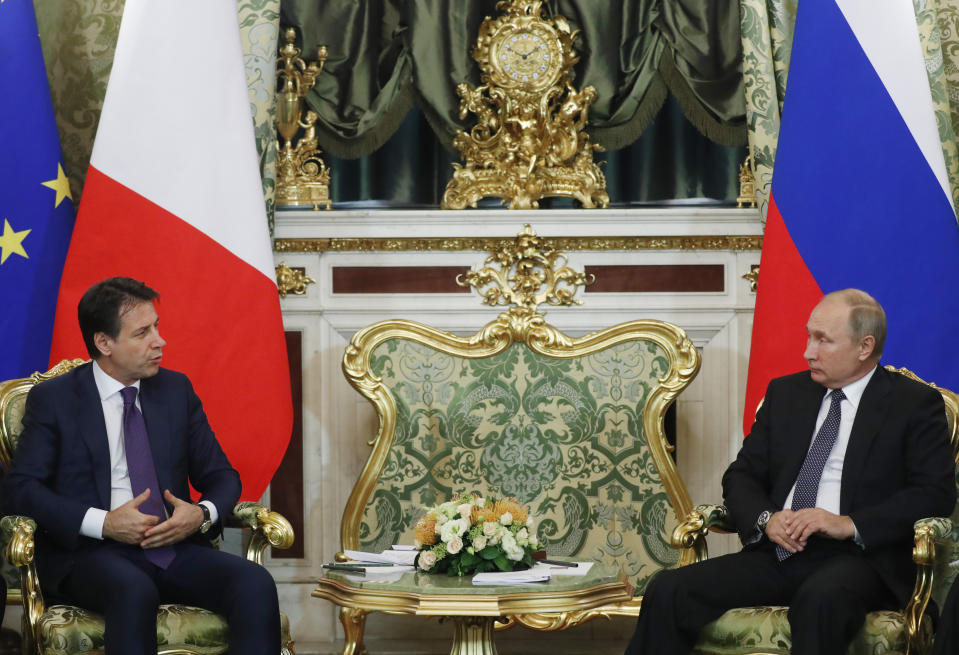 Russian President Vladimir Putin, right, listens to Italian Prime Minister Giuseppe Conte during their meeting in the Kremlin in Moscow, Russia, Wednesday, Oct. 24, 2018. Italian Prime Minister Giuseppe Conte is holding talks with Russian officials on his first trip to Moscow. (Sergei Chirikov/Pool Photo via AP)