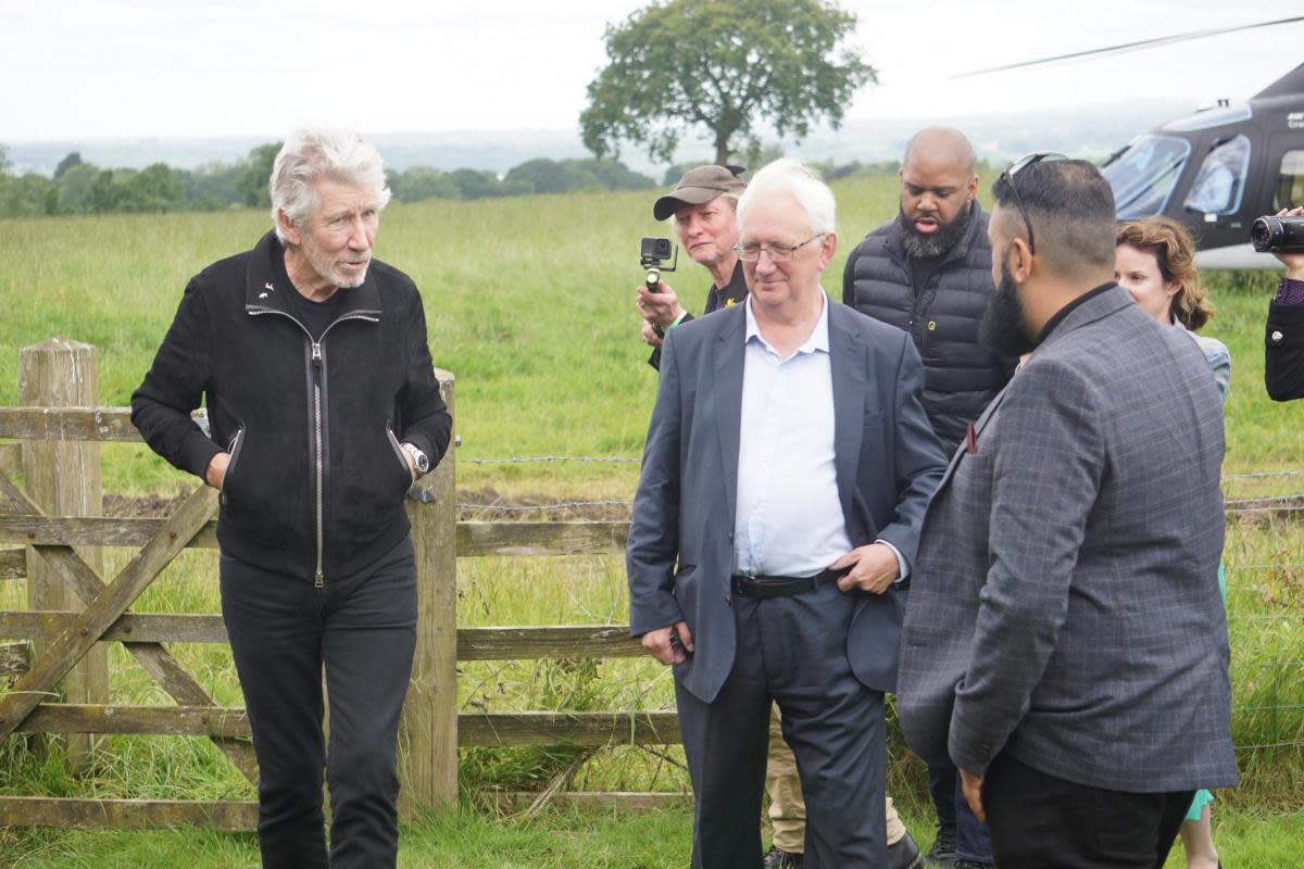 Craig Murray greeted Mr Waters as he arrived by helicopter at Stanley House Hotel <i>(Image: Nq/LT)</i>