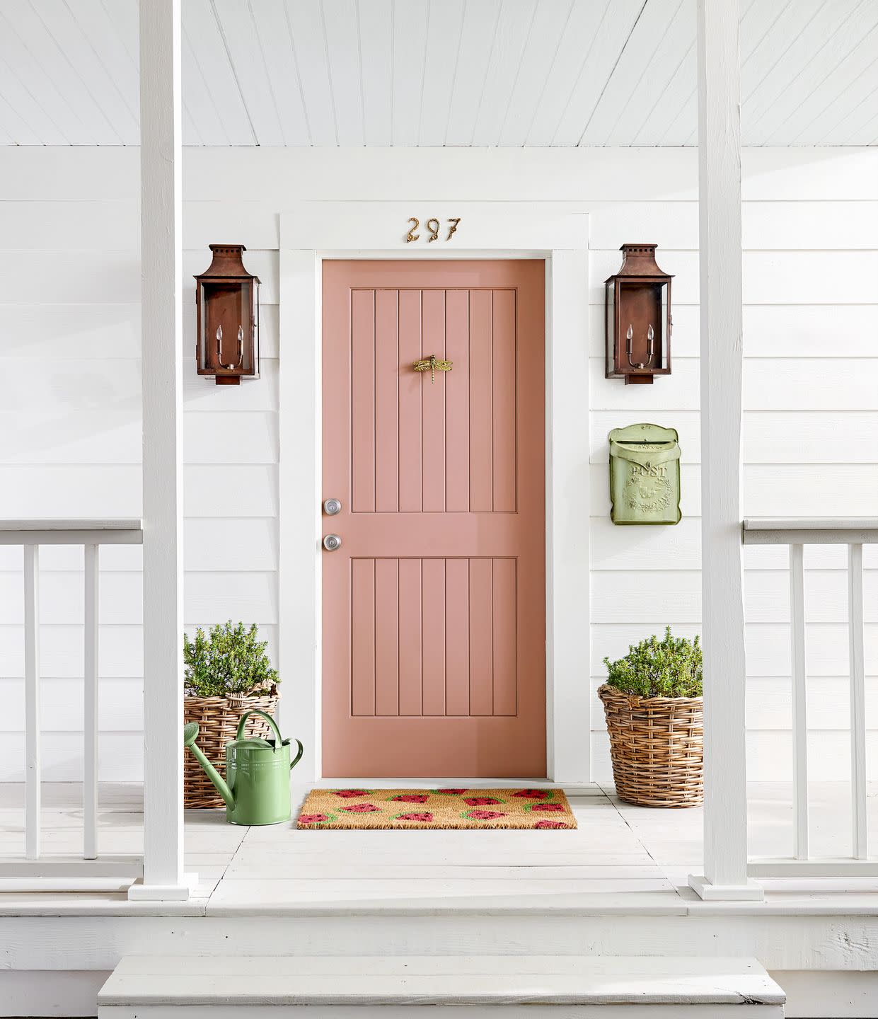 white exterior with salmon colored front door