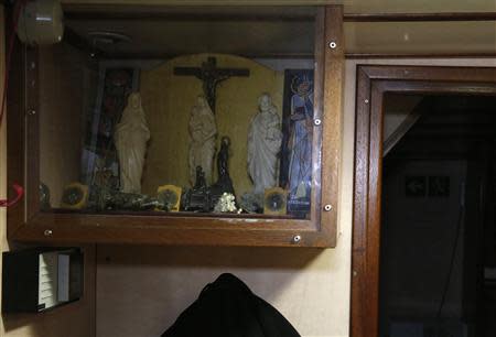 Religious icons are displayed aboard the Boulogne sur Mer based trawler "Nicolas Jeremy" off the coast of northern France October 21, 2013. REUTERS/Pascal Rossignol