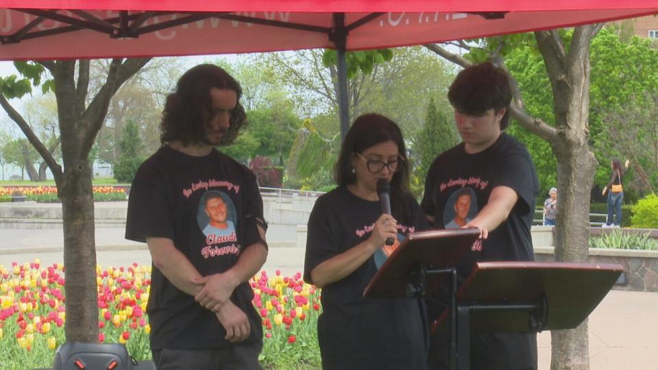 Veronica Cardoso and her sons address Windsor's gathering recognizing the national Day of Mourning for fallen workers on April 28, 2024.