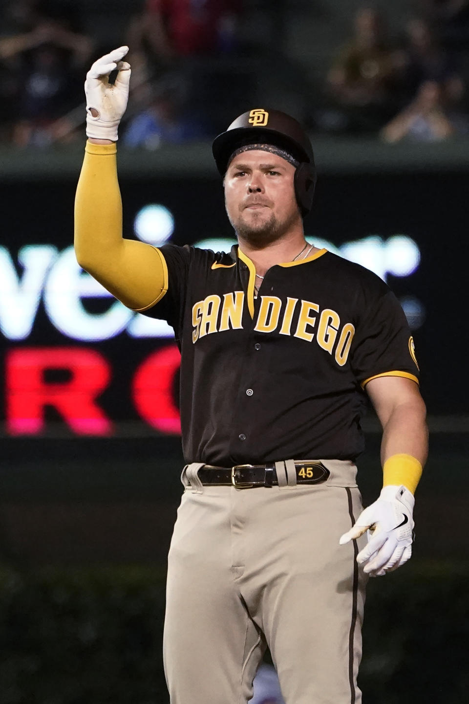 San Diego Padres' Luke Voit gestures after his three-run double off Chicago Cubs relief pitcher Mychal Givens during the seventh inning of a baseball game Tuesday, June 14, 2022, in Chicago. (AP Photo/Charles Rex Arbogast)