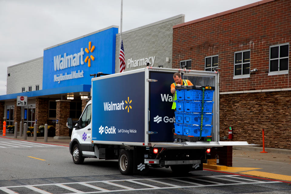 Unloading the driverless truck at a Walmart Neighborhood Market.