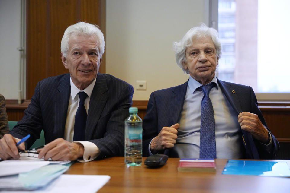 Lawyers Mikhail Biryukov, left, and Genri Reznik sit in the courtroom before a hearing on the lawsuit to liquidate the Moscow Helsinki Group in Moscow, Russia, Wednesday, Jan. 25, 2023. The Moscow Helsinki Group is one of the country's oldest human rights organizations. (AP Photo/Alexander Zemlianichenko)