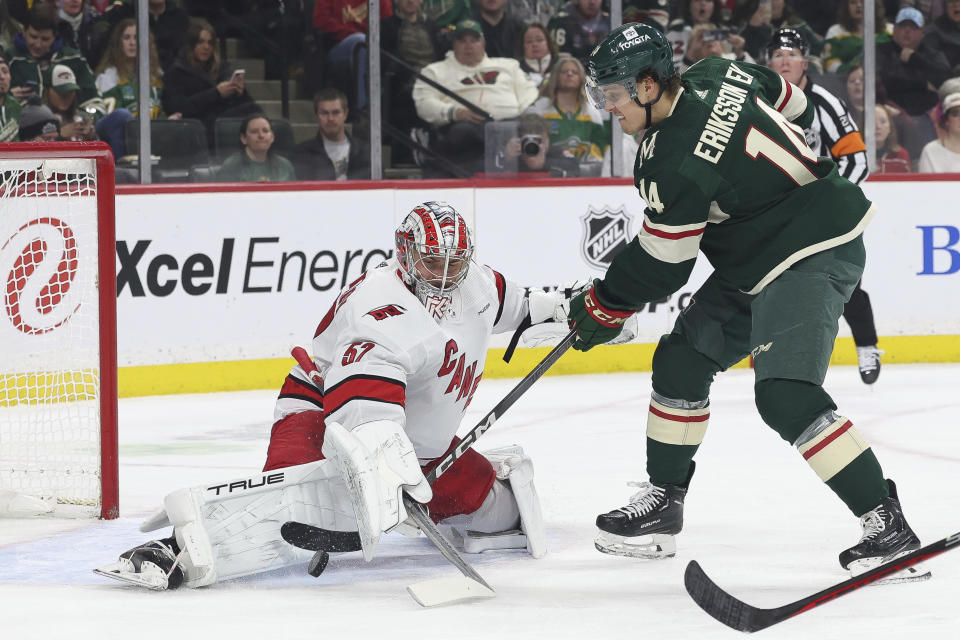 Minnesota Wild center Joel Eriksson Ek (14) tries to score against Carolina Hurricanes goaltender Pyotr Kochetkov (52) during the first period of an NHL hockey game Tuesday, Feb. 27, 2024, in St. Paul, Minn. (AP Photo/Stacy Bengs)