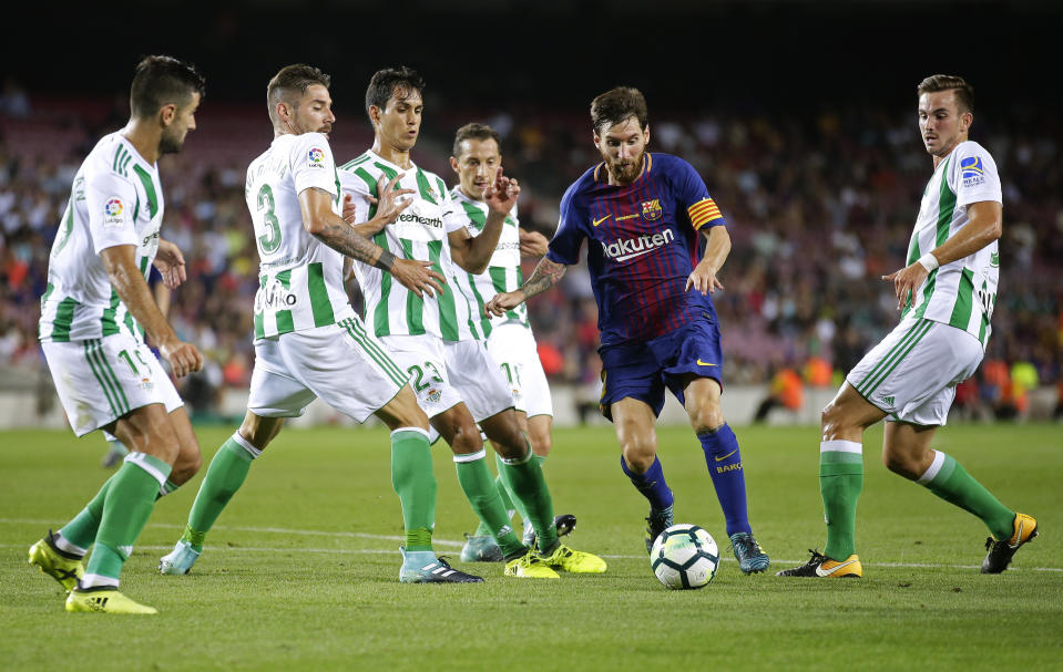 FILE - FC Barcelona's Lionel Messi, second right, in action during the Spanish La Liga soccer match between FC Barcelona and Betis at the Camp Nou stadium in Barcelona, Spain on Aug. 20, 2017. Lionel Messi says he is coming to Inter Miami and joining Major League Soccer. After months of speculation, Messi announced his decision Wednesday, June 7, 2023,to join a Miami franchise that has been led by another global soccer icon in David Beckham since its inception but has yet to make any real splashes on the field. (AP Photo/Manu Fernandez, File)