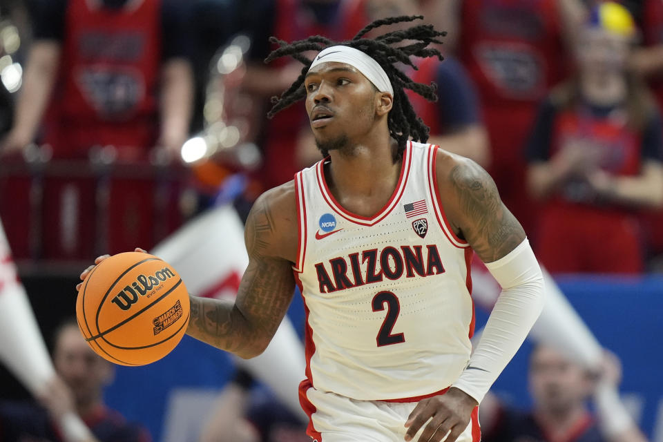 Arizona guard Caleb Love (2) brings the ball up court during the second half of a second-round college basketball game against Dayton in the NCAA Tournament in Salt Lake City, Saturday, March 23, 2024. (AP Photo/Rick Bowmer)