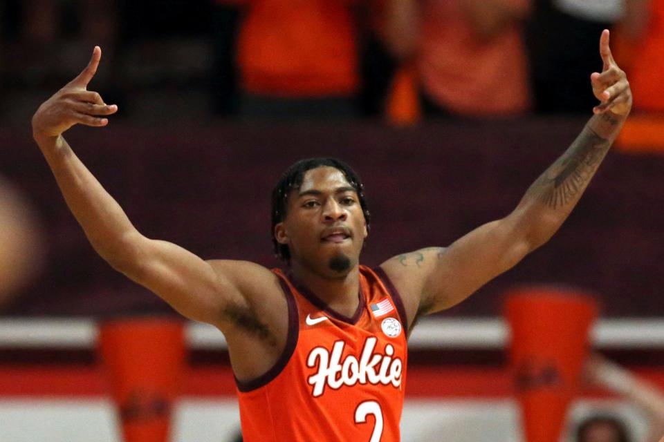 Virginia Tech's MJ Collins celebrates after making a 3-pointer against Louisville.