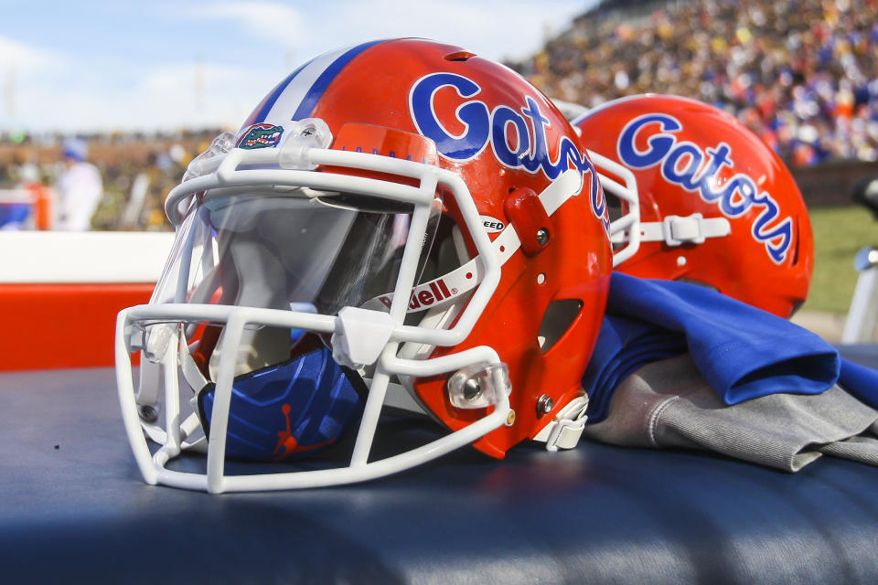 Florida Gators helmets sit atop a table.