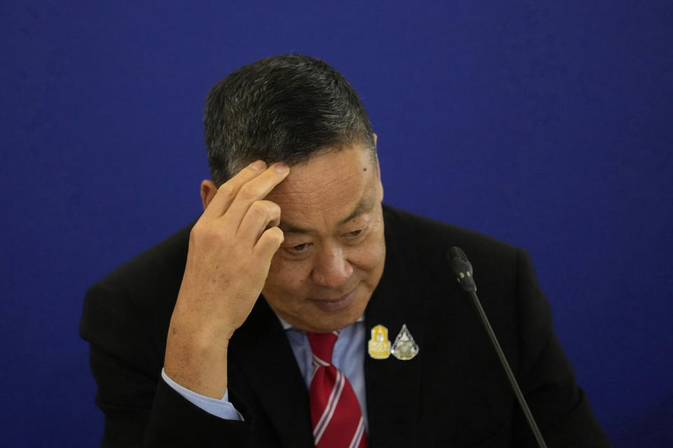 File- Thailand's Prime Minister Srettha Thavisin gestures as he talks to media during a news conference at the government house in Bangkok, Thailand, Wednesday, April 10, 2024. Thailand’s Constitutional Court on Thursday, May 23, accepted a petition from members of the country’s outgoing Senate to consider suspending Thavisin from office over his appointment of a Cabinet member. The court ruled that Srettha’s appointment of Pichit Chuenban as Minister of the Prime Minister’s Office was in violation of section 160 of the constitution, which bars those who have been sentenced to imprisonment or those who fail to comply with “ethical standards.” (AP Photo/Sakchai Lalit, File)