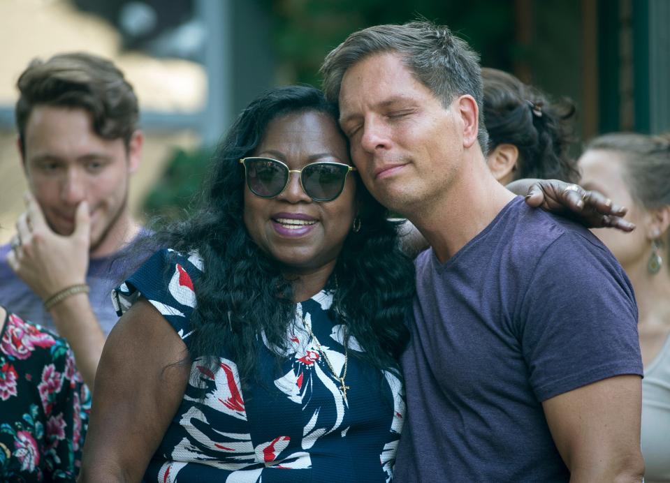 Don Damond, the fiance of Justine Damond, is comforted outside his home by Valerie Castile, the mother of Philando Castile - Credit: Aaron Lavinsky/AP