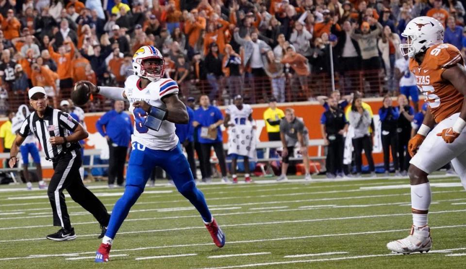 Kansas quarterback Jalon Daniels (6) throws for the game-winning two-point conversion against the Texas Longhorns in overtime at Darrell K Royal-Texas Memorial Stadium on Nov. 13, 2021.