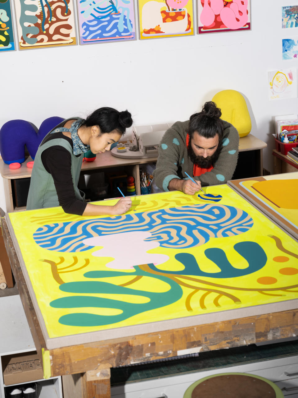 Terri Chiao and Adam Frezza (collaboratively known as Chiaozza) at work on a new painting for the solo show Slow Growth at Uprise <a href="https://wwd.com/eye/people/lynn-goldsmith-prince-photograph-andy-warhol-supreme-court-interview-1235658276/" rel="nofollow noopener" target="_blank" data-ylk="slk:Art;elm:context_link;itc:0;sec:content-canvas" class="link ">Art</a>.