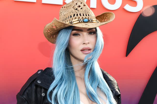 <p>Tommaso Boddi/Getty</p> Fox sported blue hair in April