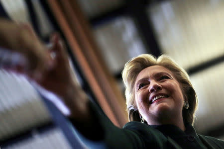 U.S. Democratic presidential nominee Hillary Clinton shakes hands with supporters after a campaign event in Cleveland, Ohio U.S., October 21, 2016. REUTERS/Carlos Barria