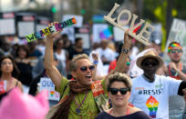 <p>Marchers celebrate during the Los Angeles LGBTQ #ResistMarch, Sunday, June 11, 2017, in West Hollywood, Calif. (Photo: Mark J. Terrill/AP) </p>