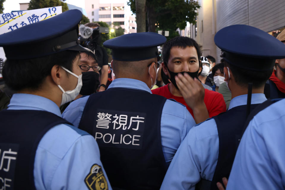 <p>People protest against the Tokyo 2020 Summer Olympic Games outside the National Stadium. Tokyo was to host the 2020 Summer Olympics from 24 July to 9 August 2020, however because of the COVID-19 pandemic the games have been postponed for a year and are due to take place from 23 July to 8 August 2021. Valery Sharifulin/TASS (Photo by Valery Sharifulin\TASS via Getty Images)</p> 