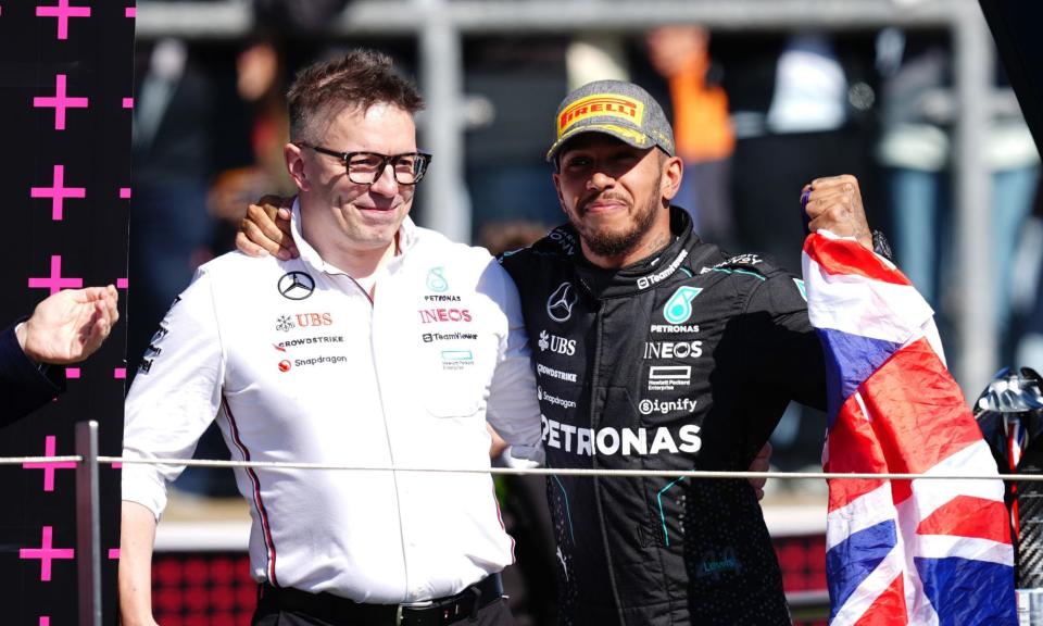 <span>Lewis Hamilton celebrates his win with his race engineer Peter Bonnington on the podium at Silverstone.</span><span>Photograph: David Davies/PA</span>