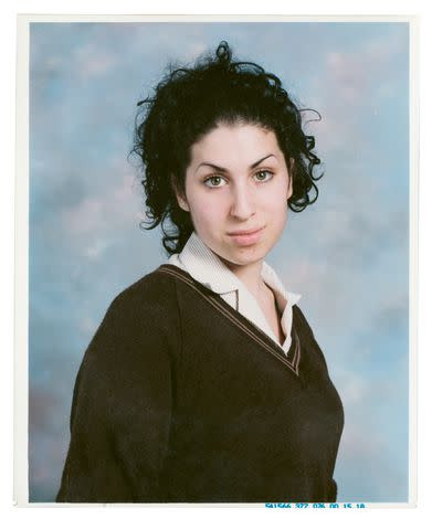 <p>Courtesy of HarperCollins</p> A school photo of a teenage Amy, who grew up in North London in the U.K.