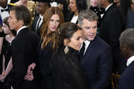 Julia Roberts and her husband Daniel Moder, and Matt Damon and his wife Luciana Barroso attend the Kennedy Center honorees reception at the White House in Washington, Sunday, Dec. 4, 2022. (AP Photo/Manuel Balce Ceneta)