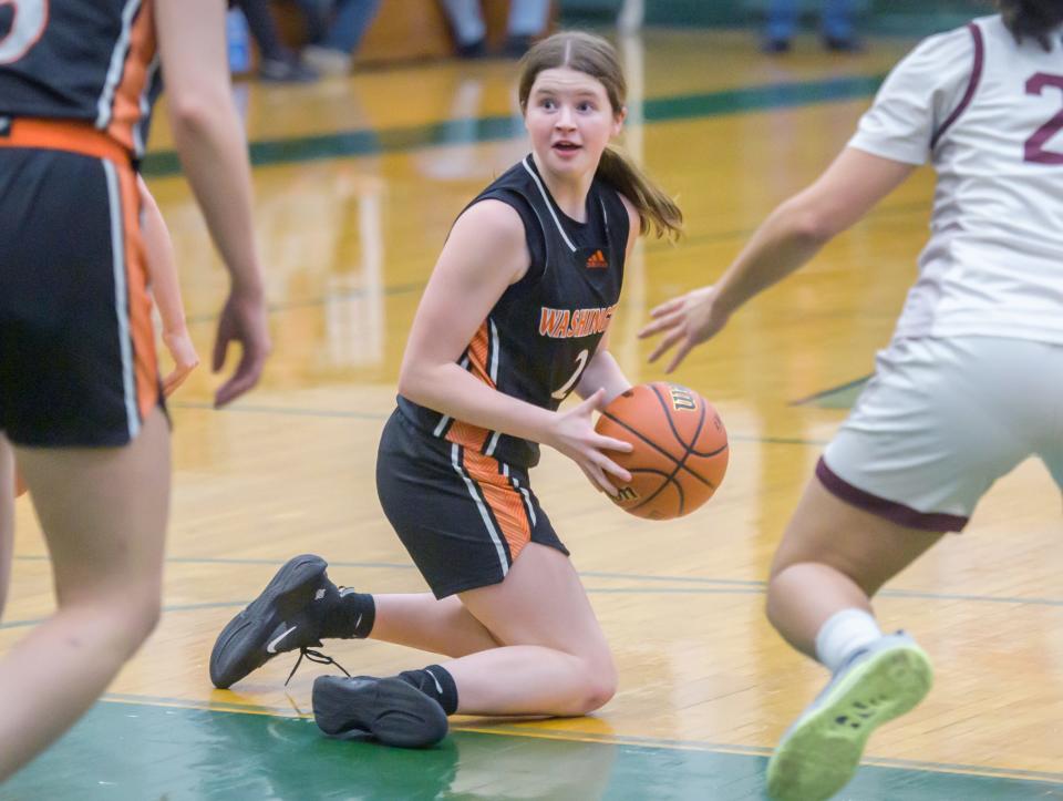 Washington's Avery Tibbs looks for help after recovering a loose ball from Peoria High in the first half of the Class 3A Girls Basketball Richwoods Sectional title game Thursday, Feb. 23, 2023 at Richwoods High School. The Lions advanced to the Pontiac supersectional with a 35-29 win over the Panthers.