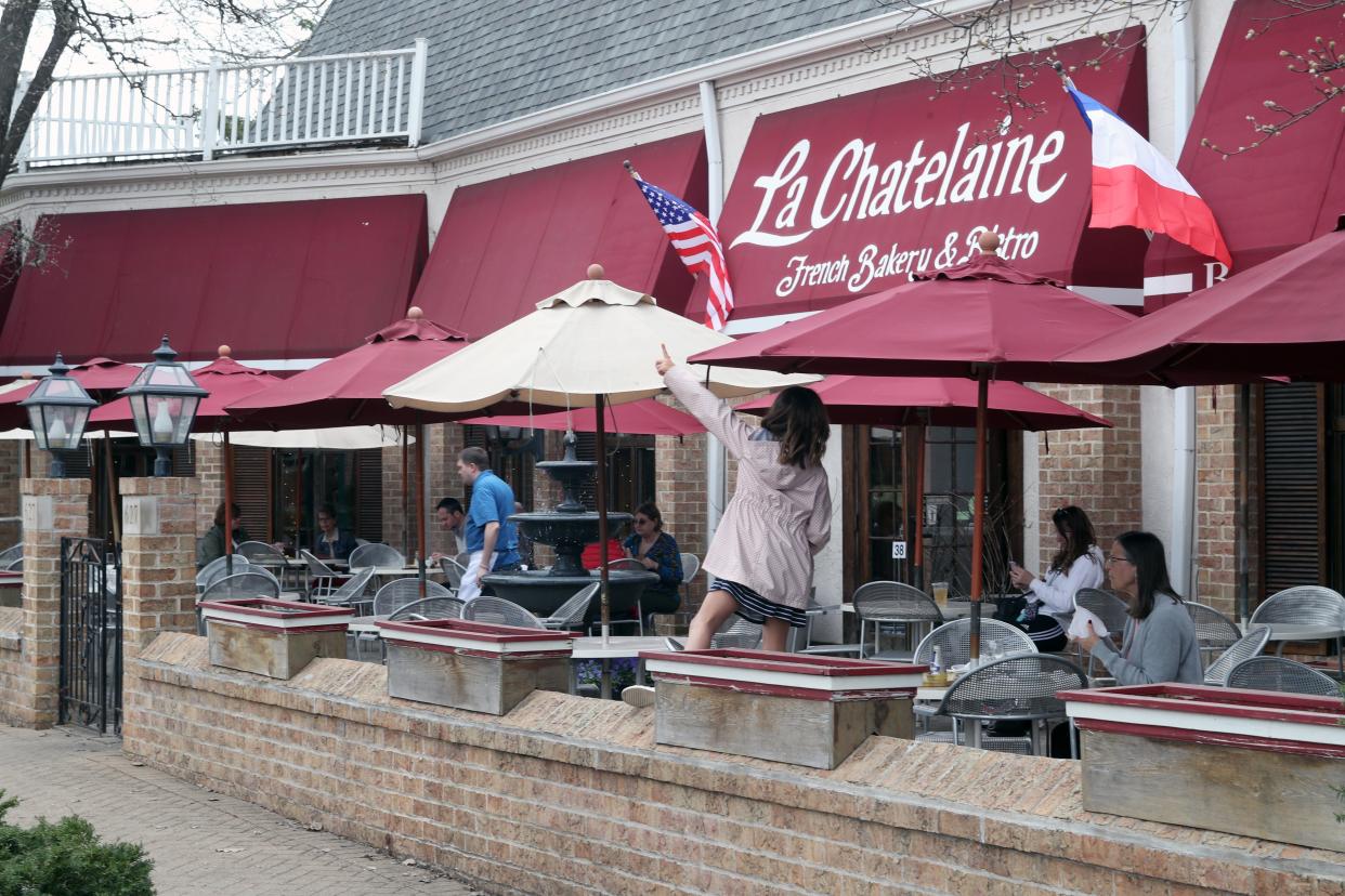 Patrons dine in the outdoor seating area at La Chatelaine French Bakery & Bistro on March 18 in Worthington.