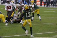 Green Bay Packers' Davante Adams (17) catches a two-yard pass against the Tampa Bay Buccaneers during the second half of the NFC championship NFL football game in Green Bay, Wis., Sunday, Jan. 24, 2021. (AP Photo/Matt Ludtke)