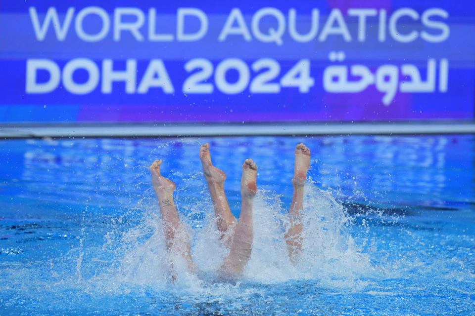 Shelly Bobritsky and Ariel Nassee, of Israel, compete in the women's duet technical of artistic swimming at the World Aquatics Championships in Doha, Qatar, Monday, Feb. 5, 2024. (AP Photo/Hassan Ammar)