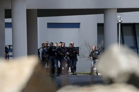 Police inside the Tocqueville high school after a shooting has taken place injuring at least eight people, in Grasse, southern France, March 16, 2017. REUTERS/Eric Gaillard