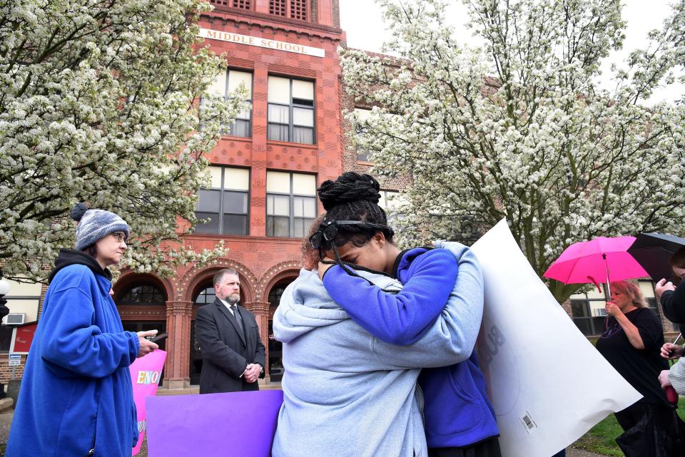 Monroe Middle School eighth grader Mickeya Goins hugs her classmate Trinity Small after she spoke out against bullying at the "Justice for Gary" anti-bullying rally Friday, April 28, 2023, at Monroe Middle School. Goins' best friend Gary Ross, 13, an eighth grader at Monroe Middle School, died by suicide April 19, 2023.