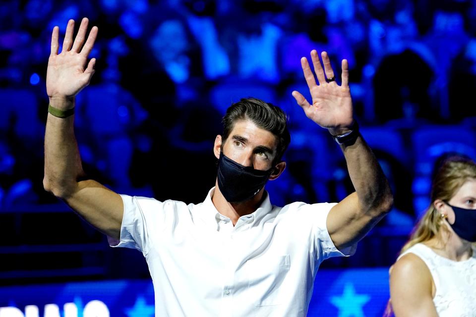 Michael Phelps waves to the crowd during the Medal Ceremony during the U.S. Olympic Team Trials Swimming competition at CHI Health Center Omaha.