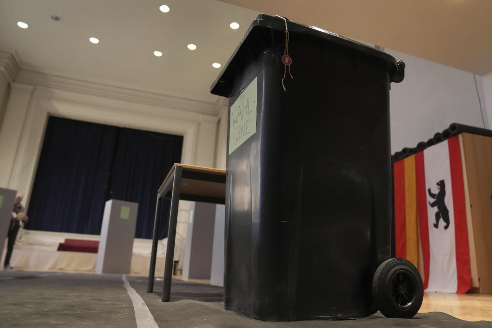 A wheelie bin is used as a ballout box at a polling station in Berlin, Germany, Sunday, Feb. 12, 2023. The city of Berlin on Sunday, Feb. 12, 2023, holds a court-ordered rerun of a chaotic 2021 state election that was marred by severe glitches at many polling stations. (AP Photo/Michael Sohn)