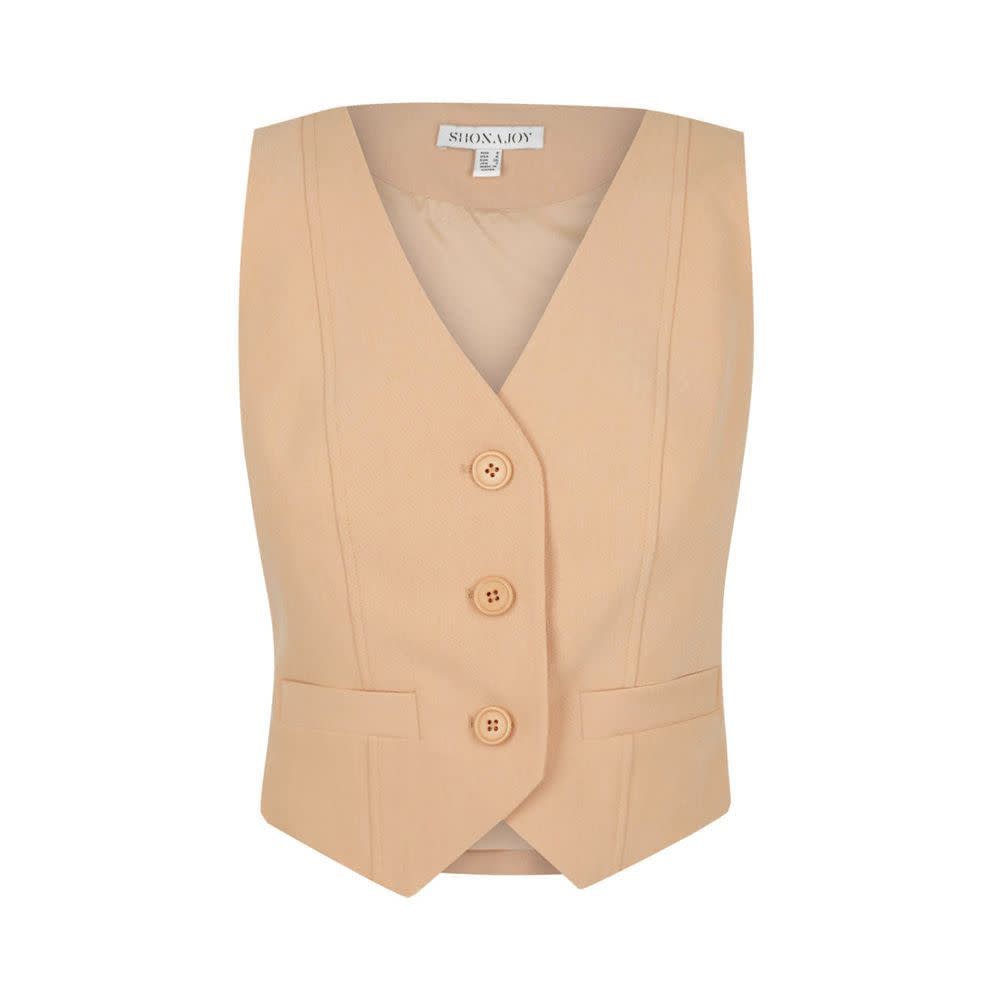 <p><a href="https://shonajoy.com/products/irena-tailored-fitted-vest-peanut-butter?gclid=CjwKCAjwyqWkBhBMEiwAp2yUFlwmyxxLGTR14z6iQCfV5FYosm6_0xG2xuEYr6qrK-h1ngOFyTychhoCOTEQAvD_BwE" rel="nofollow noopener" target="_blank" data-ylk="slk:Shop Now;elm:context_link;itc:0;sec:content-canvas" class="link rapid-noclick-resp">Shop Now</a></p><p>Irena Tailored Fitted Vest </p><p>shonajoy.com</p><p>$155.00</p>