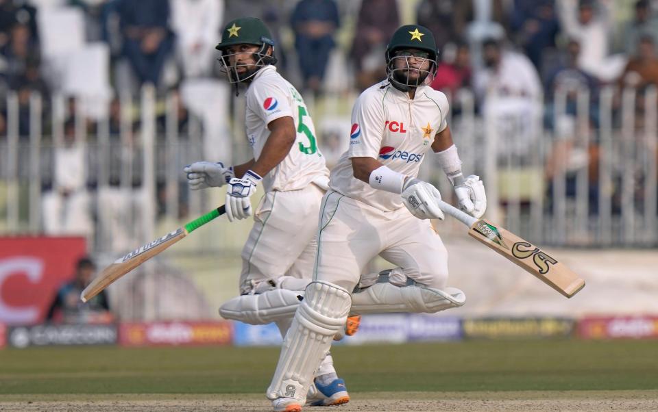 Pakistan's Imam-ul-Haq, right, and Abdullah Shafique run between the wickets - AP Photo/Anjum Naveed