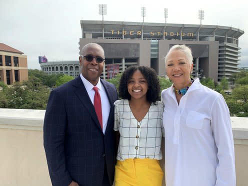 AT&T SVP & CCO, David Huntley, left, his wife, Tracey Nash-Huntley, right, and LSU student, Staci Shelby, center, at the LSU Foundation next to LSU’s Tiger Stadium.