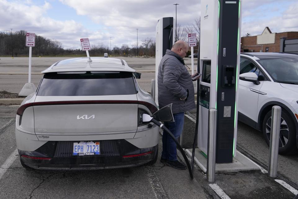 Mark Gendregske of Alger, Michigan, charges his Kia EV6, Friday, Feb. 10, 203 in Ypsilanti, Mich. Gendregske says it starts to get serious when temperatures drop to the 10- to 20-degree Fahrenheit (minus 7 to minus 12 Celsius) range. "I see typically more than 20% degradation in range as well as charging time," he said while recharging his Kia EV6. "I go from about 250 miles of range to about 200." (AP Photo/Carlos Osorio)