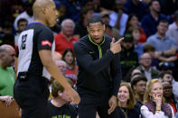 New Orleans Pelicans coach Willie Green talks to an official during the first half of the team's NBA basketball game against the Los Angeles Clippers in New Orleans, Friday, March 15, 2024. (AP Photo/Matthew Hinton)