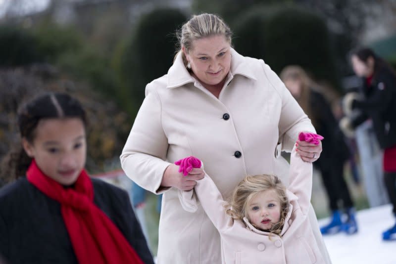 Children of local Marine Corps and military-connected families skate on the White House Ice Rink ahead of Wednesday's Toys for Tots event hosted by first lady Jill Biden. Photo by Bonnie Cash/UPI