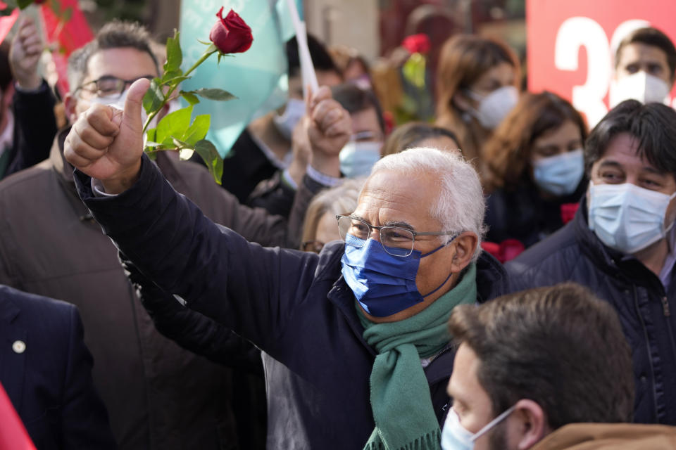 Portuguese Prime Minister and Socialist Party Secretary General Antonio Costa, center, gestures during an election campaign action in the outskirts of Lisbon, Thursday, Jan. 27, 2022. Portugal holds a general election on Jan. 30. (AP Photo/Armando Franca)