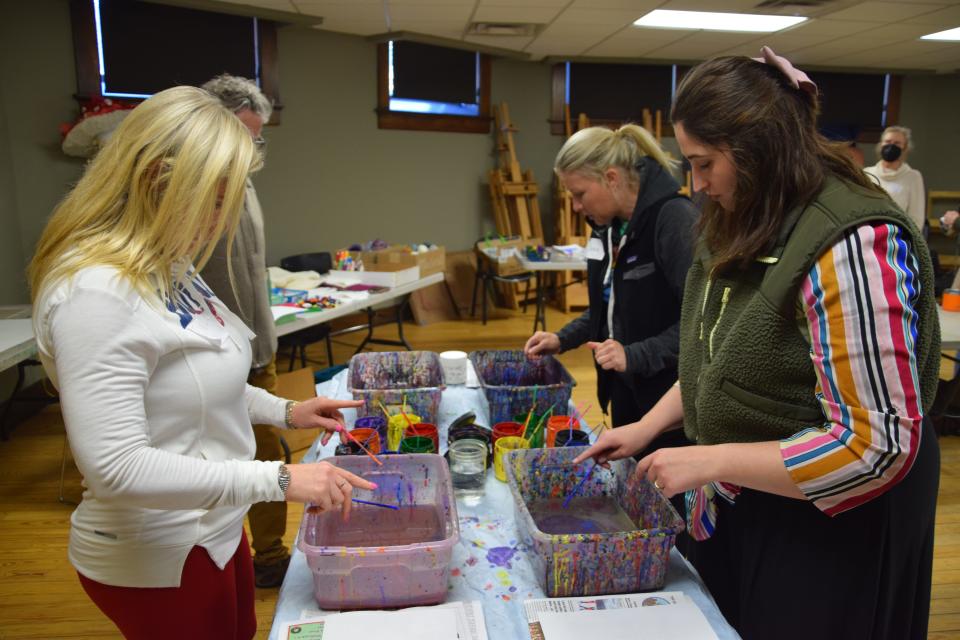 A group of teachers practice the art of suminagashi on April 15, 2024.