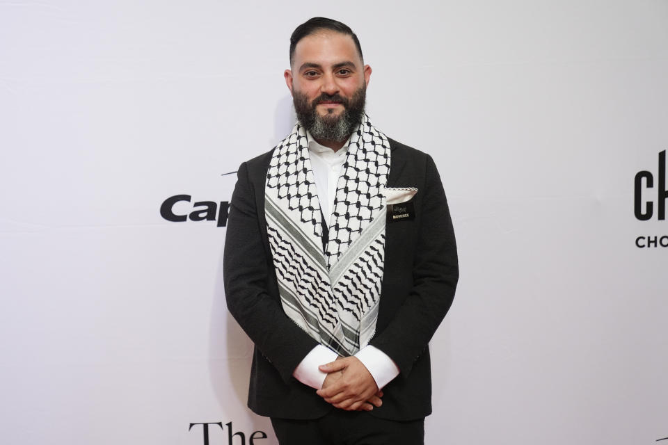 Chef Michael Rafidi of Albi in Washington, D.C., stands on the red carpet before the James Beard Awards ceremony Monday, June 10, 2024, in Chicago. Rafidi won the James Beard award for Outstanding Chef. (AP Photo/Erin Hooley)