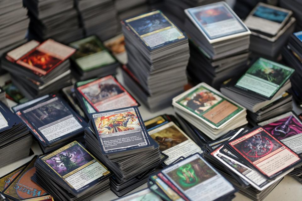 Stacks of common and uncommon Magic the Gathering cards wait to be sorted for sale at The Gamers' Keep in Barberton.