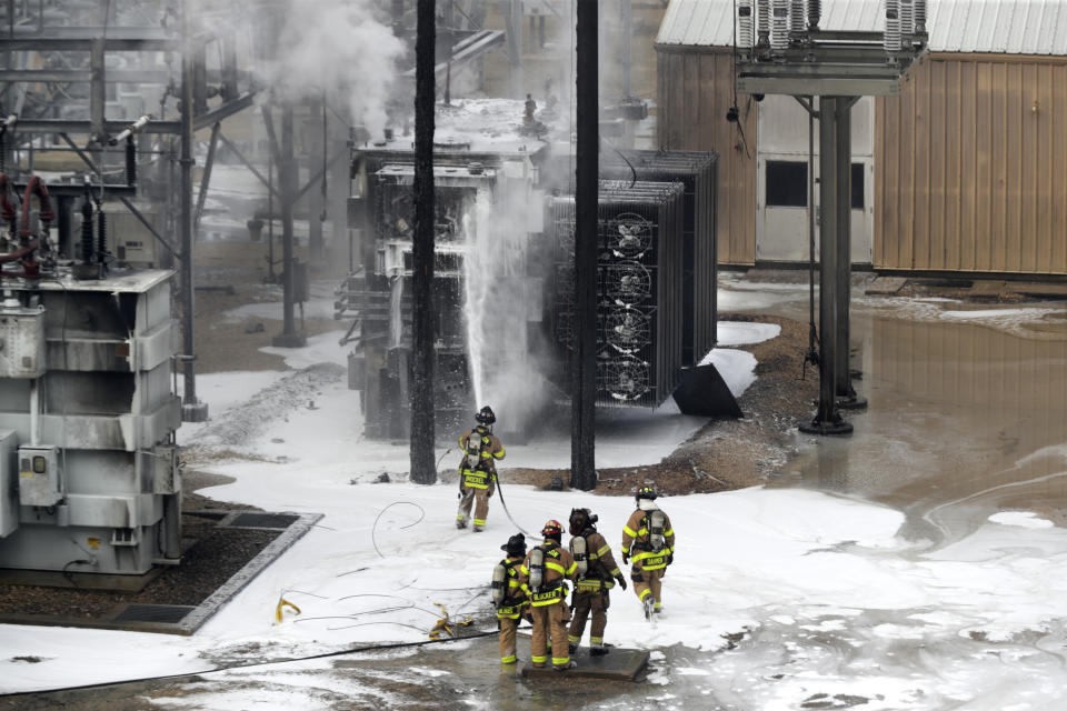 Members of the Madison Fire department respond at the scene of a fire at Madison Gas and Electric, Friday, July 19, 2019 in Madison, Wis. (Steve Apps/Wisconsin State Journal via AP)